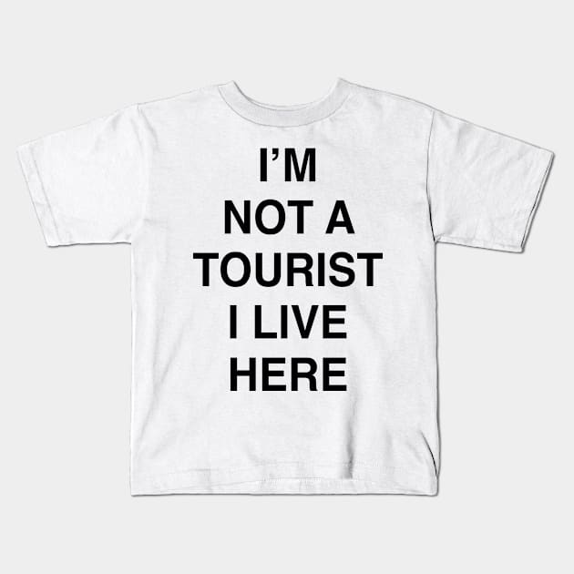 I’M NOT A TOURIST I LIVE HERE Kids T-Shirt by TheCosmicTradingPost